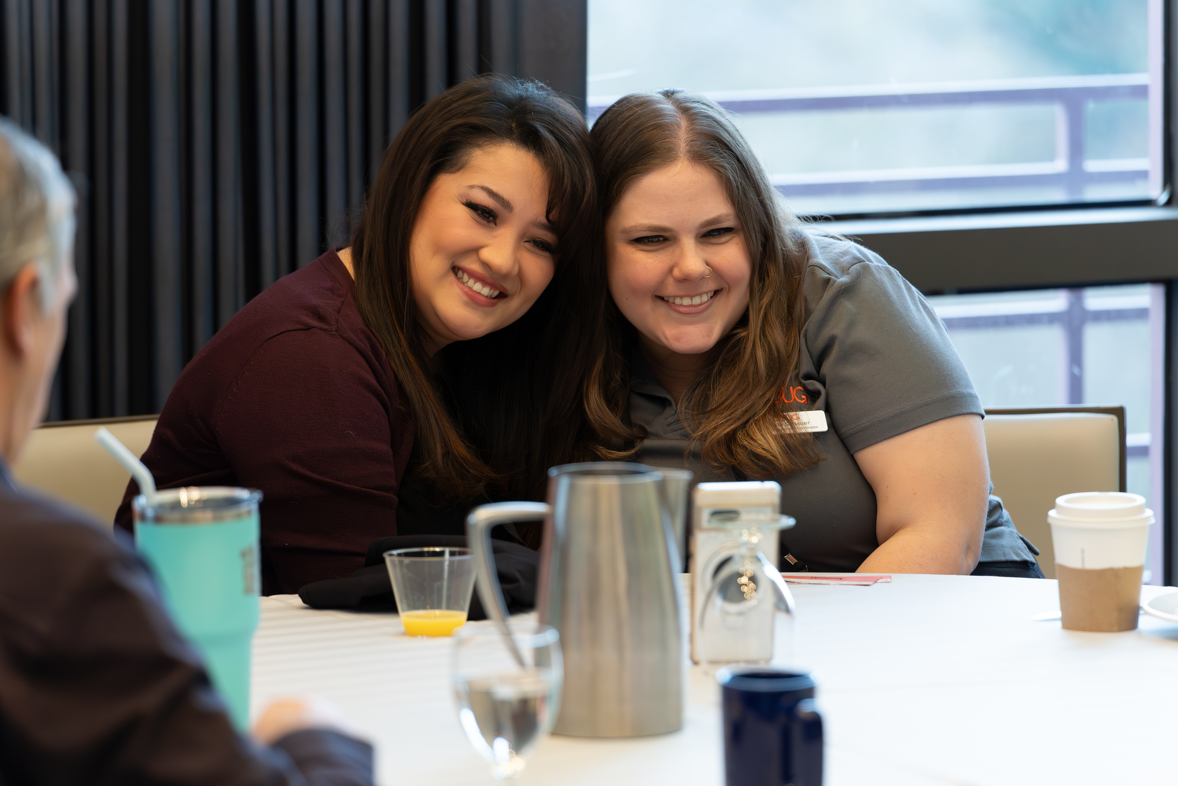 Krysta embracing a volunteer Secondary